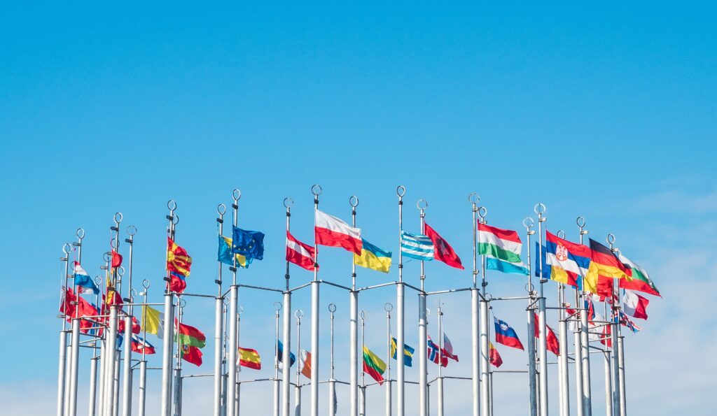 Flags of the world on flagpoles, copy space for text